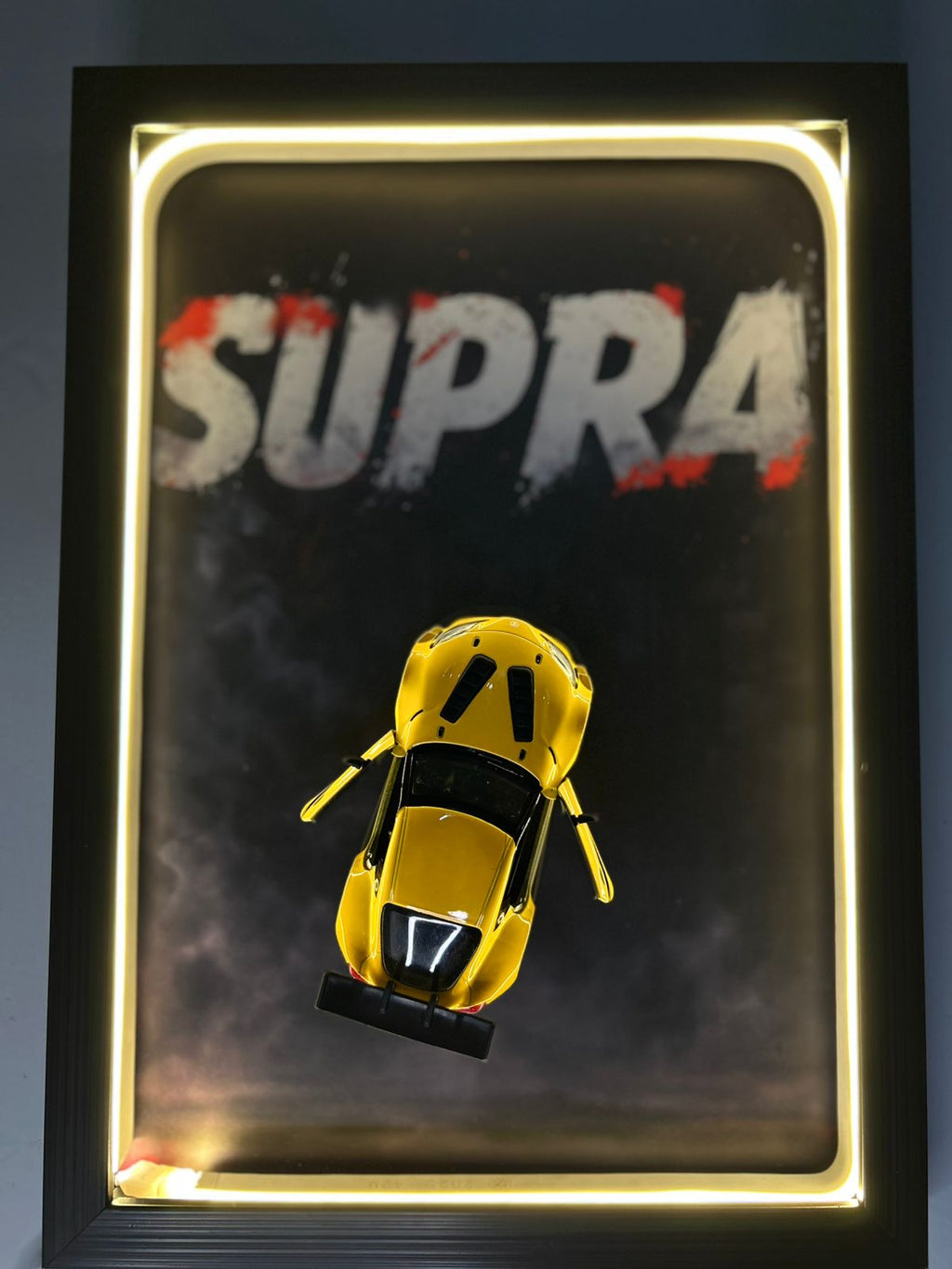 Toyota GR Supra – 1:38 Scale Diecast Model in a Warm Neon Shadow Frame