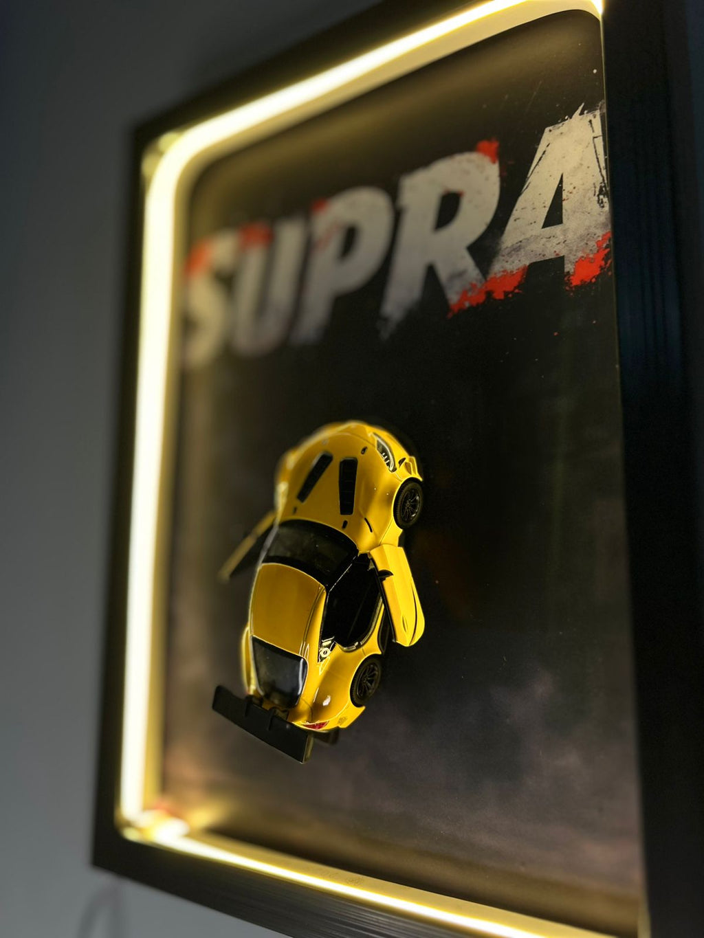 Toyota GR Supra – 1:38 Scale Diecast Model in a Warm Neon Shadow Frame