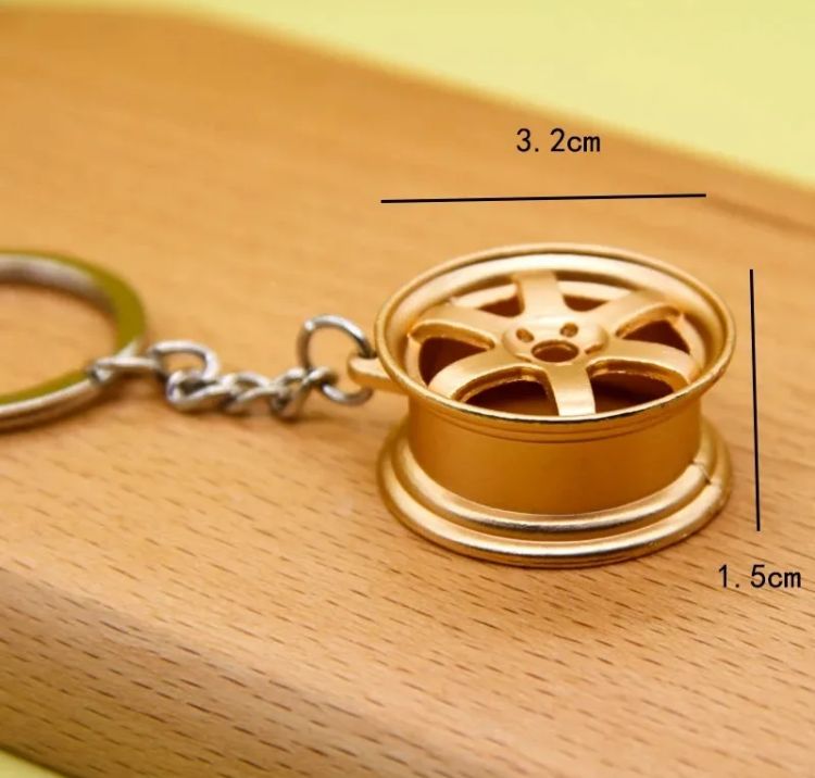 Golden Metal Wheel Keychain – Premium Automotive Design