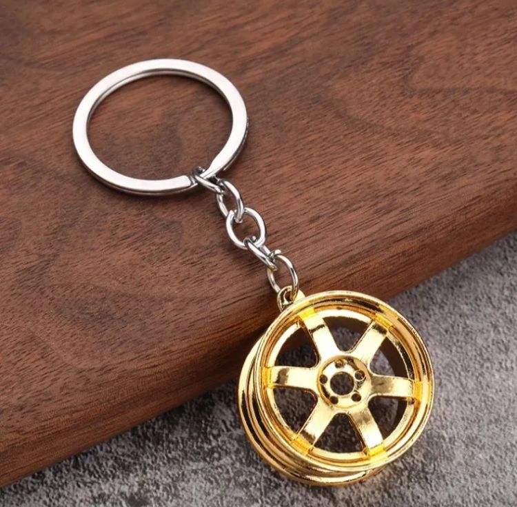 Golden Metal Wheel Keychain – Premium Automotive Design