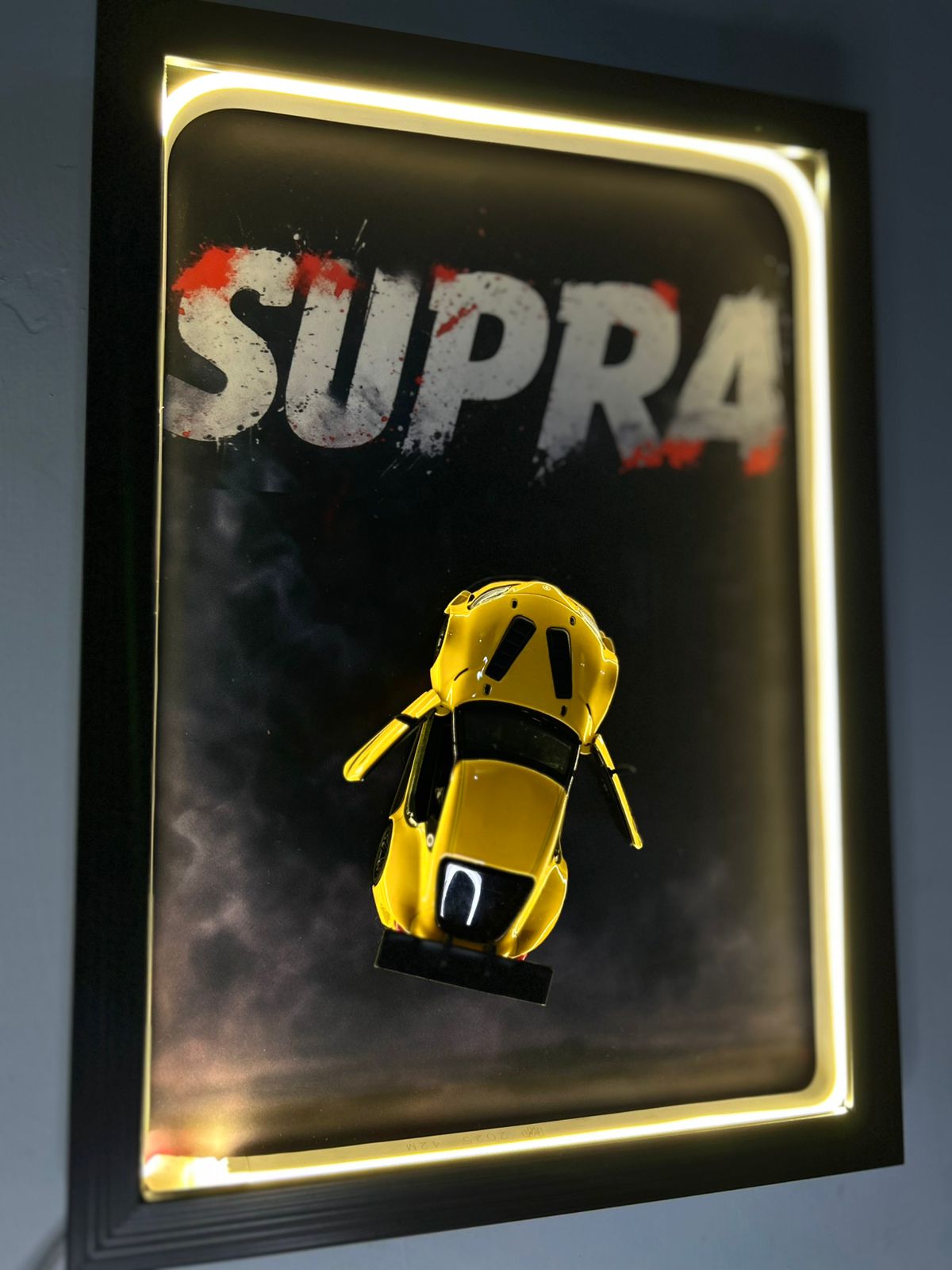 Toyota GR Supra – 1:38 Scale Diecast Model in a Warm Neon Shadow Frame